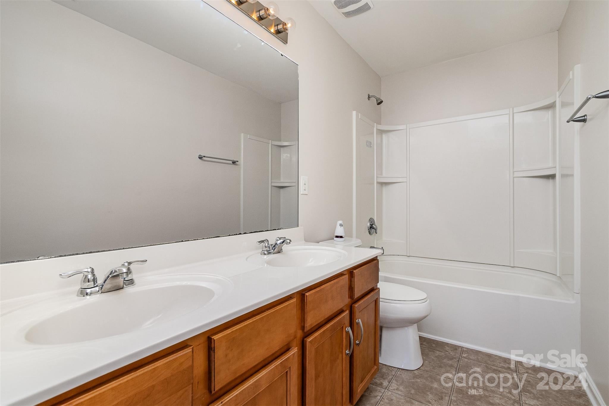 7006 Farm Pond Road Indian Trail, NC 28079 - Photo 30 of 37 a bathroom with a sink toilet tub and shower