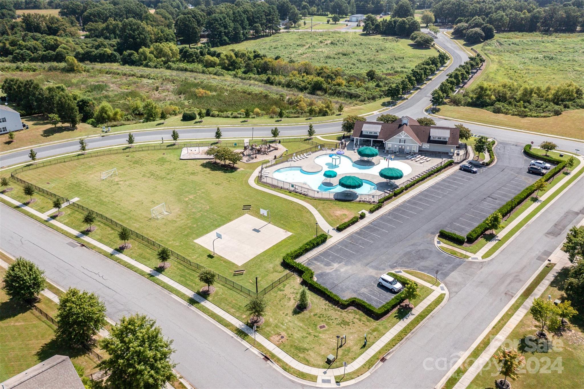 7006 Farm Pond Road Indian Trail, NC 28079 - Photo 33 of 37 a view of a swimming pool with a patio