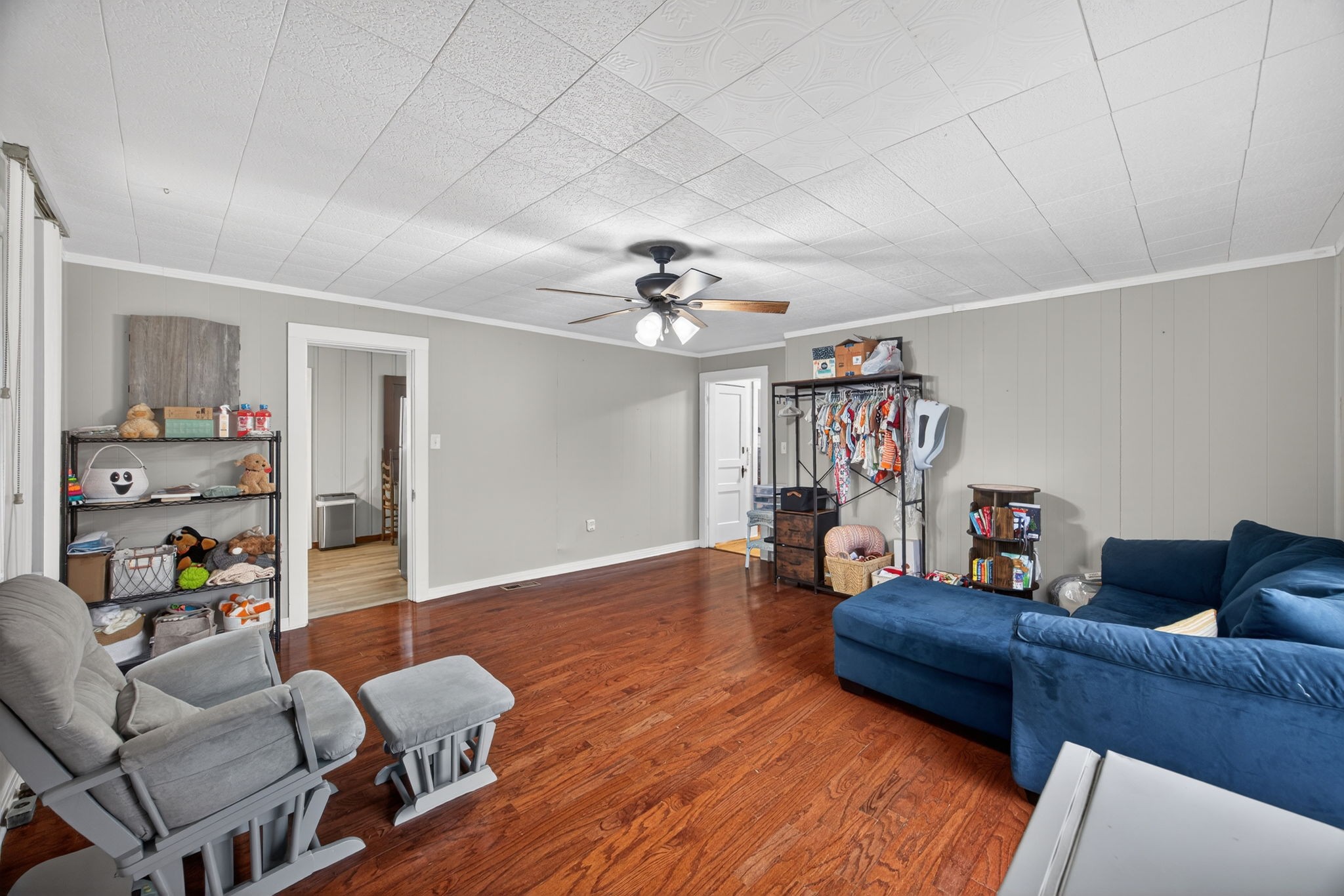 233 Buffalo Valley Road Baxter, TN 38544 - Photo 11 of 34 a living room with furniture and a chandelier