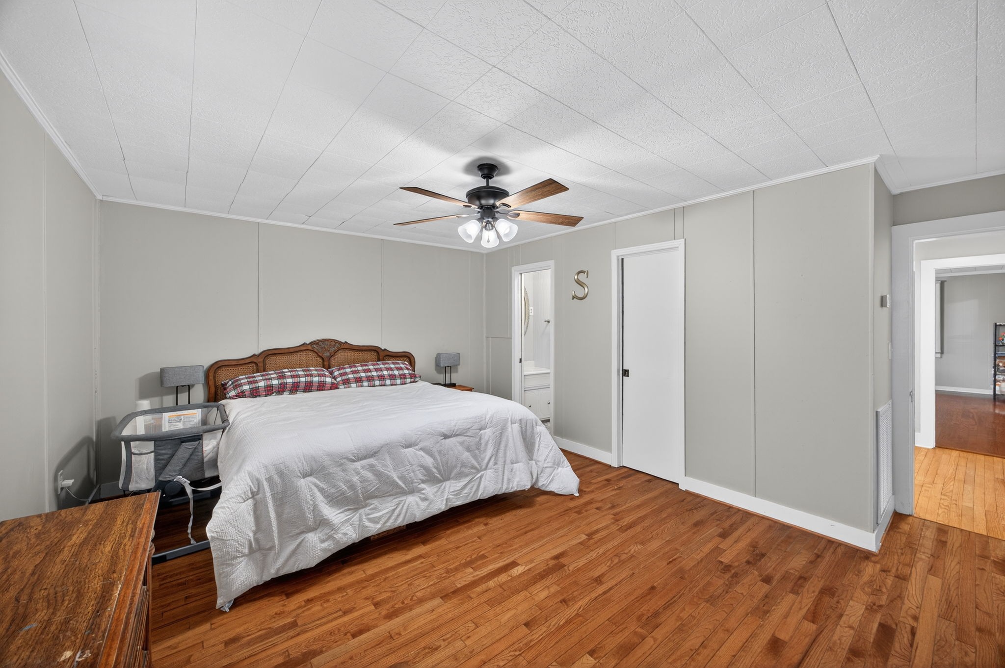 233 Buffalo Valley Road Baxter, TN 38544 - Photo 12 of 34 a bedroom with a bed and a ceiling fan