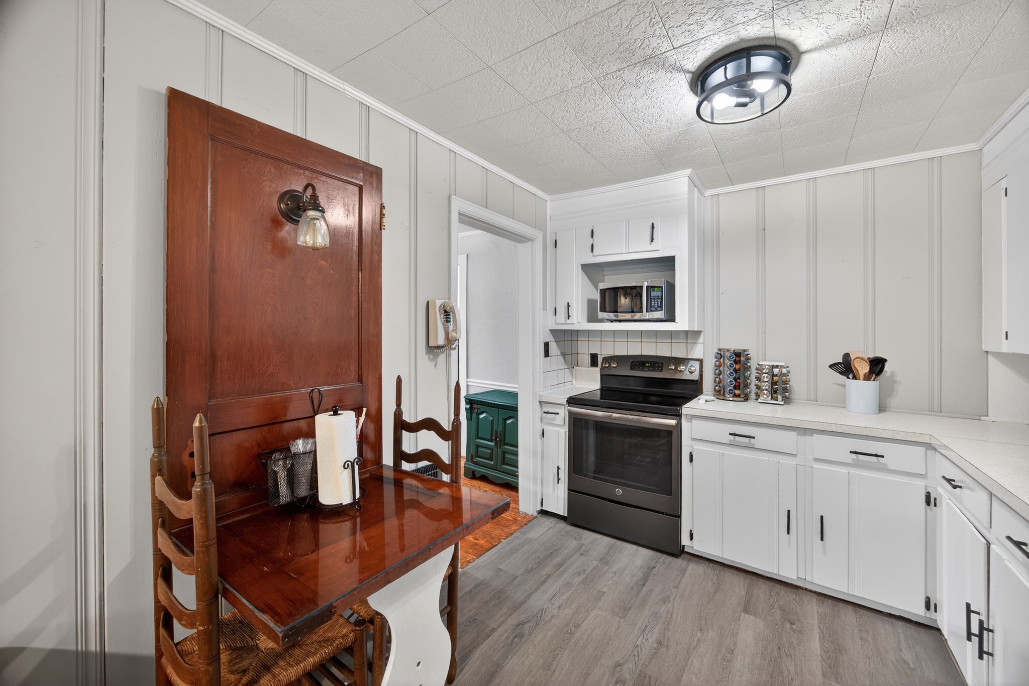 233 Buffalo Valley Road Baxter, TN 38544 - Photo 9 of 34 a kitchen with stainless steel appliances granite countertop a stove and a refrigerator