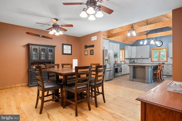 a bedroom with a bed lamp closet and window