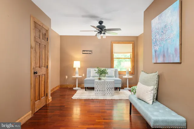 a front view of house with yard and trees