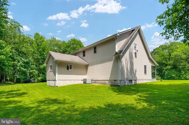 an aerial view of a house with a swimming pool