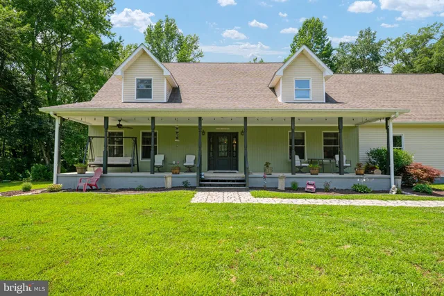 a view of a living room and floor to ceiling window and an mountain view