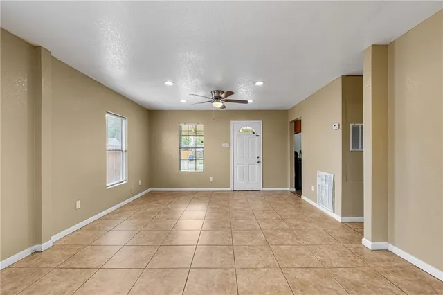 a view of an empty room and window
