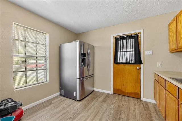 a view of kitchen with furniture wooden floor and window