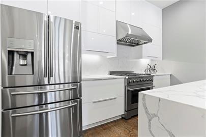 223 16th Street Northwest, Unit 6 Atlanta, GA 30363 - Photo 11 of 32 a kitchen with appliances and cabinets