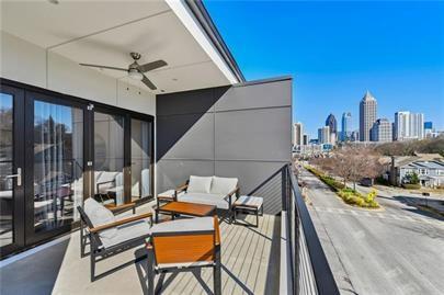 223 16th Street Northwest, Unit 6 Atlanta, GA 30363 - Photo 16 of 32 a balcony with wooden floor and outdoor seating