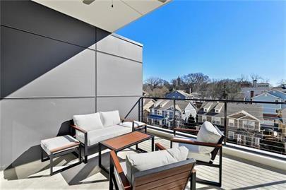 223 16th Street Northwest, Unit 6 Atlanta, GA 30363 - Photo 18 of 32 a view of a balcony with chairs