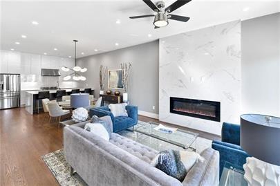 223 16th Street Northwest, Unit 6 Atlanta, GA 30363 - Photo 19 of 32 a living room with furniture and a fireplace