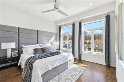 223 16th Street Northwest, Unit 6 Atlanta, GA 30363 - Photo 25 of 32 a bedroom with a large bed and a window