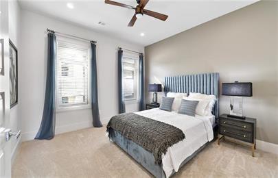 223 16th Street Northwest, Unit 6 Atlanta, GA 30363 - Photo 26 of 32 a bedroom with a bed and a tv