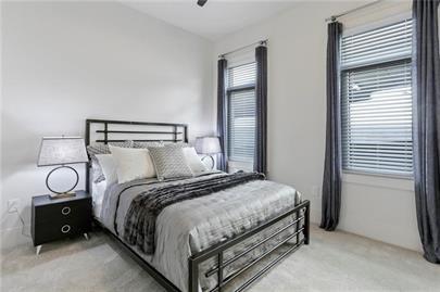 223 16th Street Northwest, Unit 6 Atlanta, GA 30363 - Photo 27 of 32 a bedroom with a bed and a window