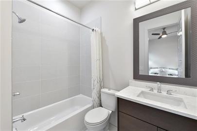223 16th Street Northwest, Unit 6 Atlanta, GA 30363 - Photo 28 of 32 a bathroom with a sink a toilet and shower