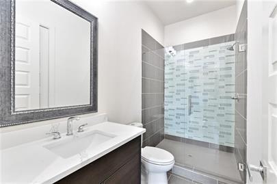 223 16th Street Northwest, Unit 6 Atlanta, GA 30363 - Photo 31 of 32 a bathroom with a sink and a mirror