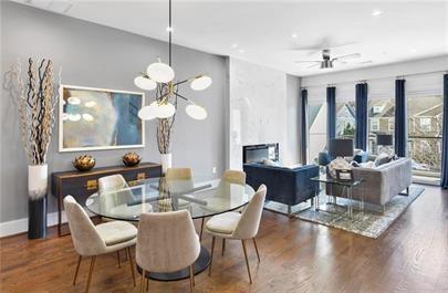 223 16th Street Northwest, Unit 6 Atlanta, GA 30363 - Photo 10 of 32 a dining room with wooden floor a chandelier a wooden table and chairs