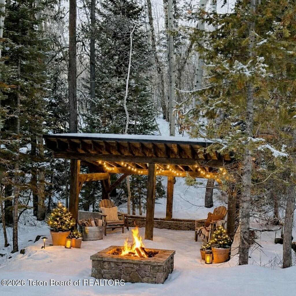 5727 Forest Ridge Road Victor, ID 83455 - Photo 19 of 76 Outdoor firepit area - Virtual Staging