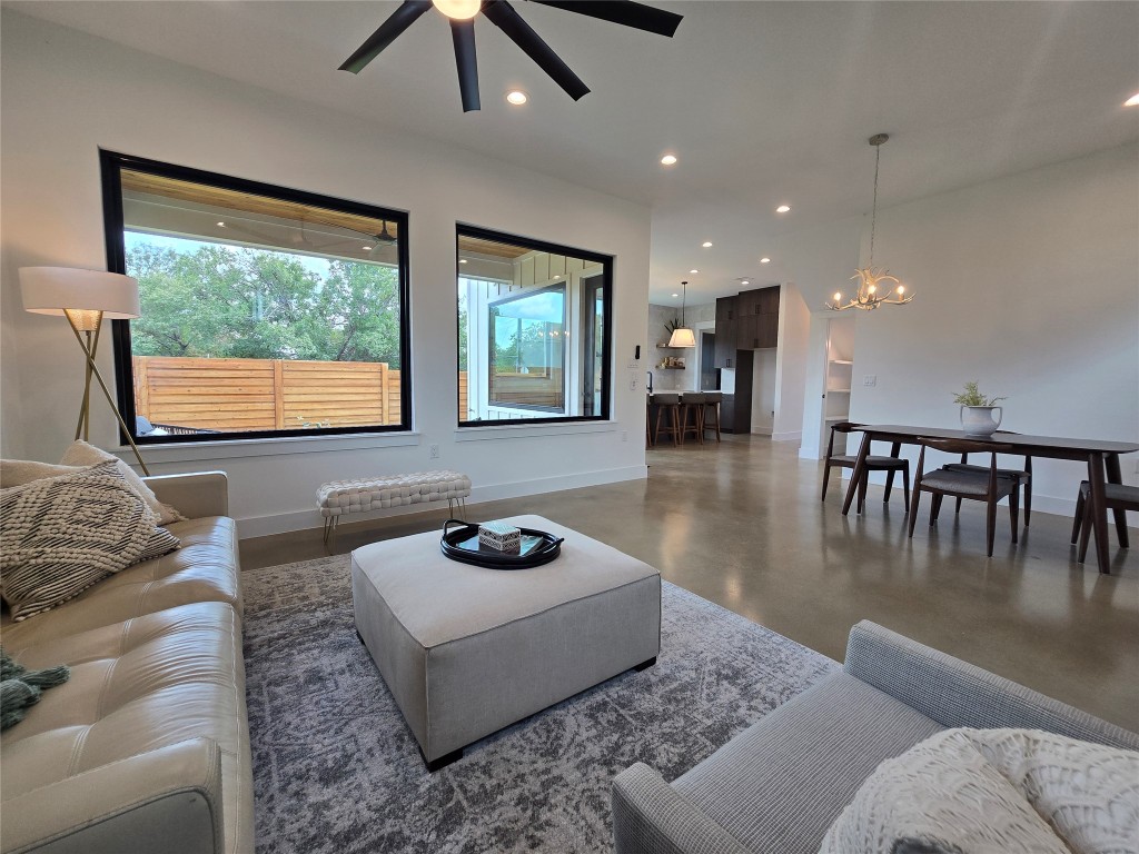 5301 Grover Avenue Austin, TX 78756 - Photo 11 of 40 Set up the living space as you wish - lots of space for dining, living, or play areas. Lots of windows throughout, uppers for light and privacy from neighbors, and huge windows to your back yard.