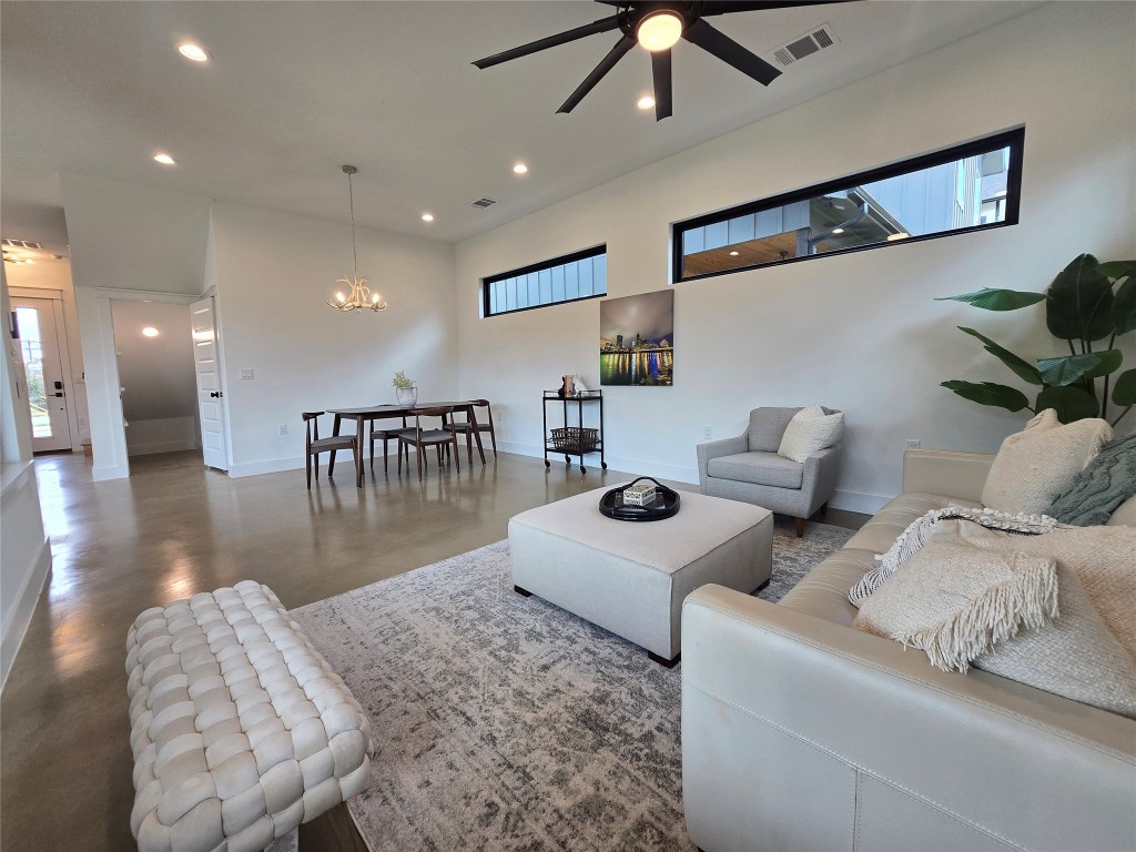 5301 Grover Avenue Austin, TX 78756 - Photo 12 of 40 Set up the living space as you wish - lots of space for dining, living, or play areas. Lots of windows throughout, uppers for light and privacy from neighbors, and huge windows to your back yard.