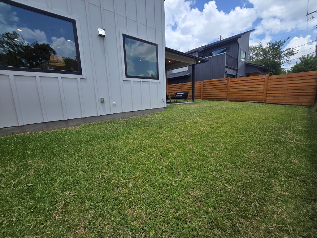 5301 Grover Avenue Austin, TX 78756 - Photo 14 of 40 Side view of the back yard, with extra gas hookups for a future outdoor kitchen or a fire pit, and an electric connection for a future hot tub.