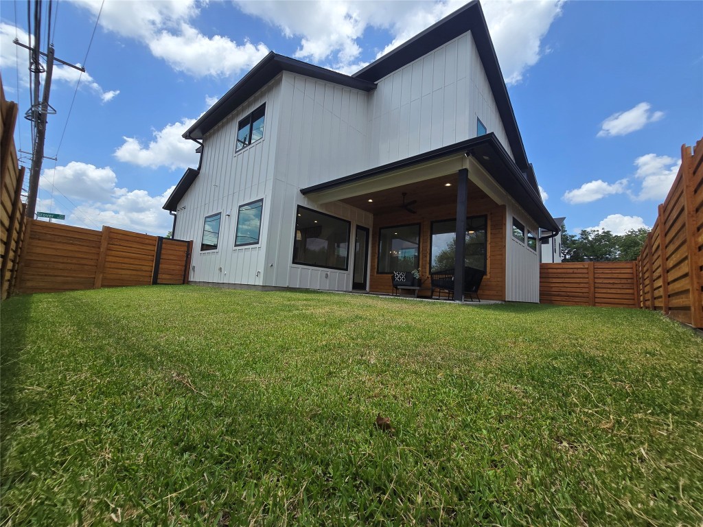 5301 Grover Avenue Austin, TX 78756 - Photo 15 of 40 Rear view of the yard with lots of grass space and shaded cover under the porch.