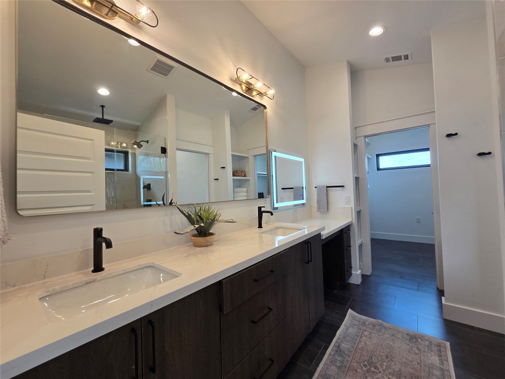 5301 Grover Avenue Austin, TX 78756 - Photo 21 of 40 Primary bath with dual vanities, and a separate makeup desk area.