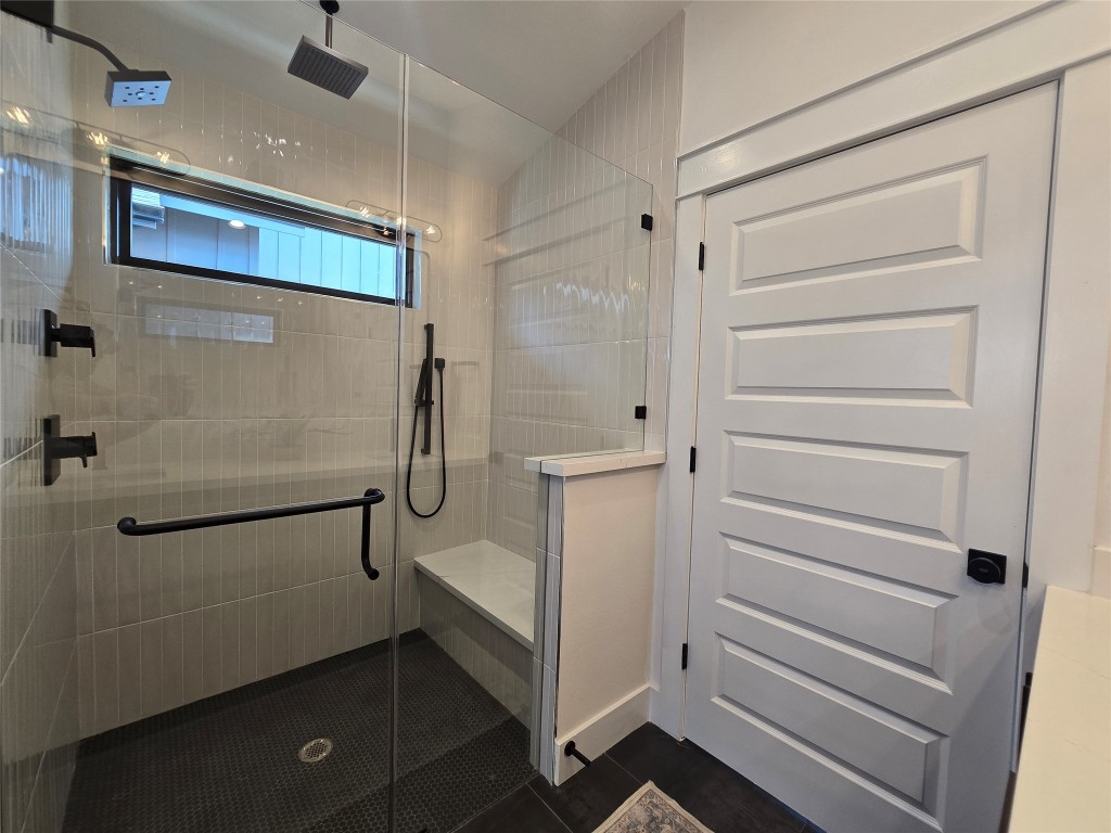 5301 Grover Avenue Austin, TX 78756 - Photo 22 of 40 Many showering options in the large walk in shower - bench, overhead shower, rain shower, and a handheld.