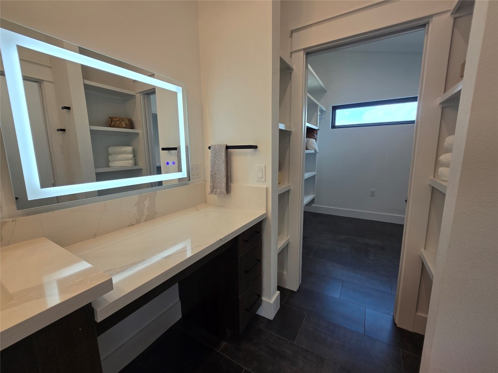 5301 Grover Avenue Austin, TX 78756 - Photo 23 of 40 The LED backlit mirror in the makeup vanity area.