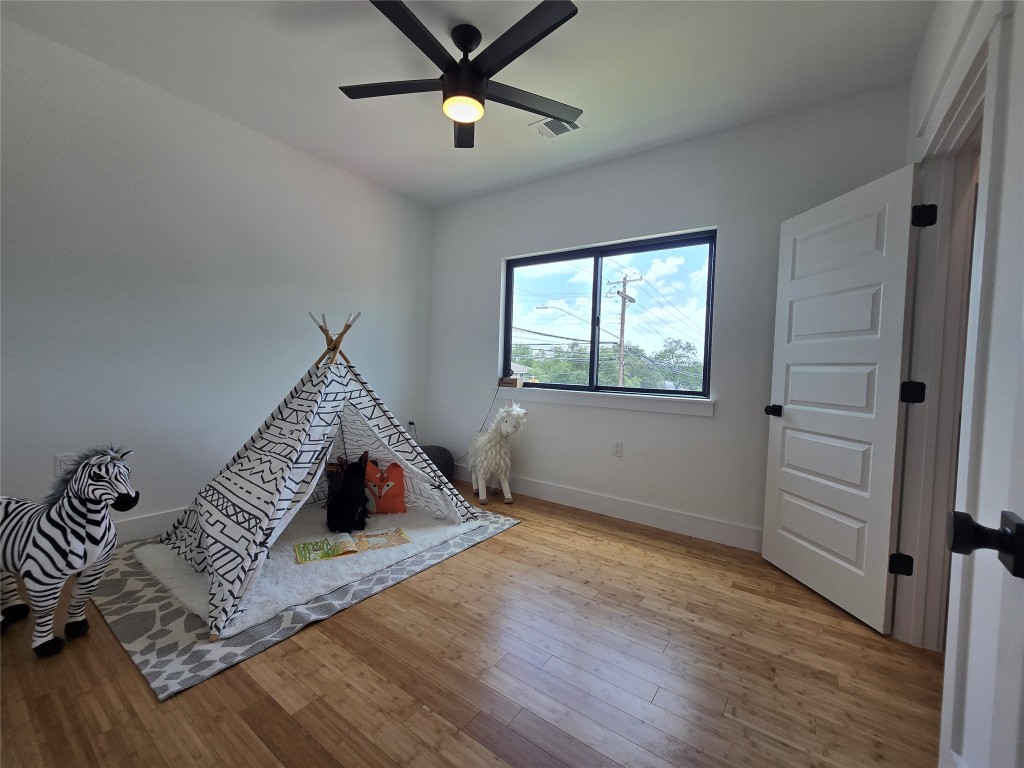 5301 Grover Avenue Austin, TX 78756 - Photo 32 of 40 Recreation room with a ceiling fan and wood finished floors