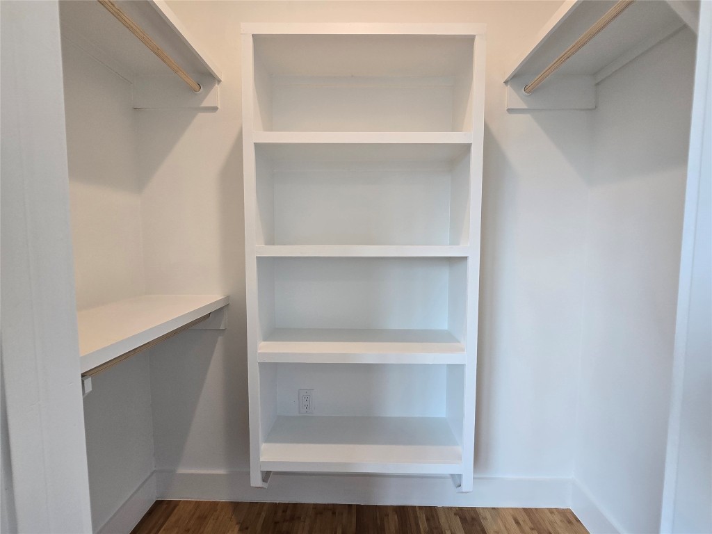 5301 Grover Avenue Austin, TX 78756 - Photo 34 of 40 Walk in closet featuring dark wood-style floors