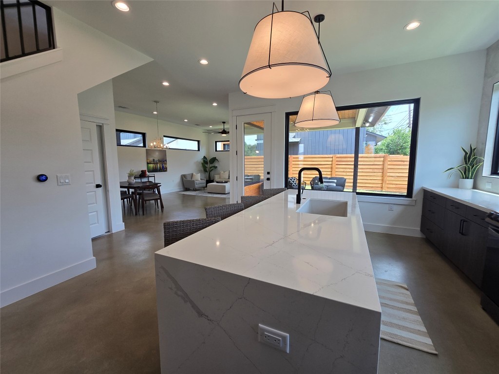 5301 Grover Avenue Austin, TX 78756 - Photo 8 of 40 Huge island in the kitchen, lots of windows throughout, and all open and easily accessible from the main living area.