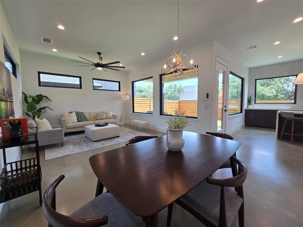 5301 Grover Avenue Austin, TX 78756 - Photo 10 of 40 Set up the living space as you wish - lots of space for dining, living, or play areas. Lots of windows throughout, uppers for light and privacy from neighbors, and huge windows to your back yard.