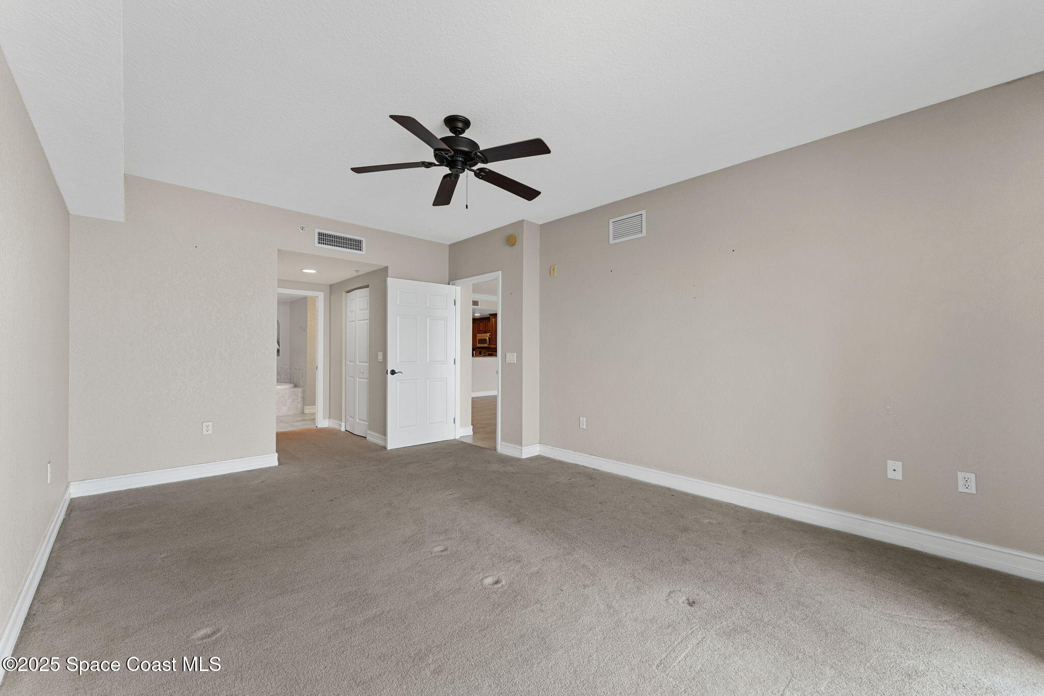480 Sail Lane, Unit 204 Merritt Island, FL 32953 - Photo 12 of 32 a view of empty room with a ceiling fan