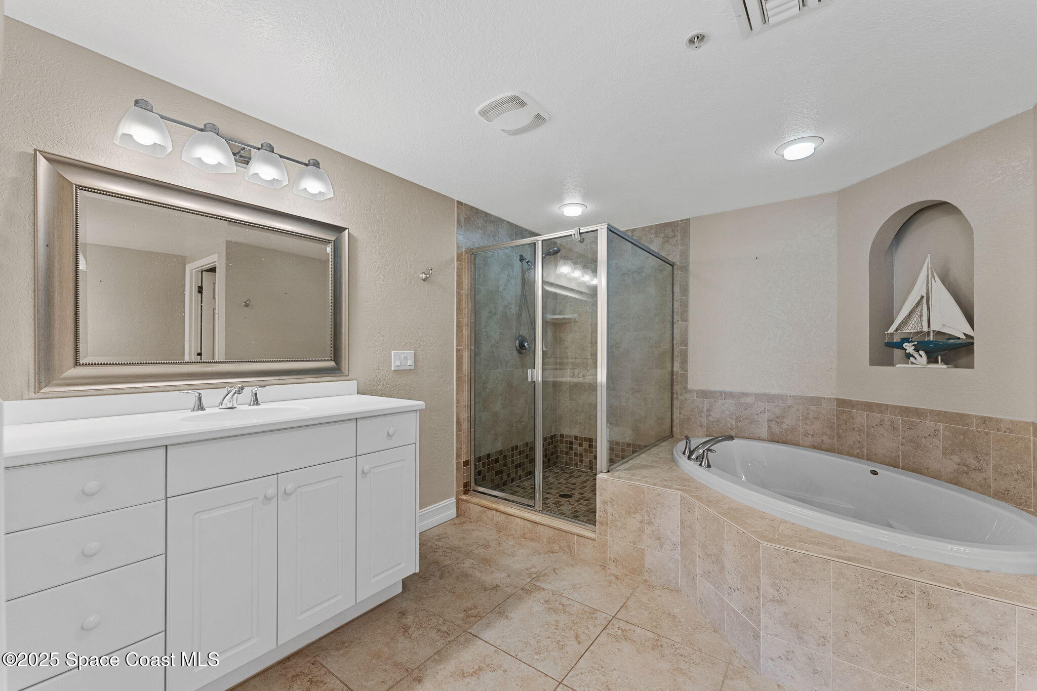 480 Sail Lane, Unit 204 Merritt Island, FL 32953 - Photo 14 of 32 a bathroom with a double vanity sink mirror and bathtub