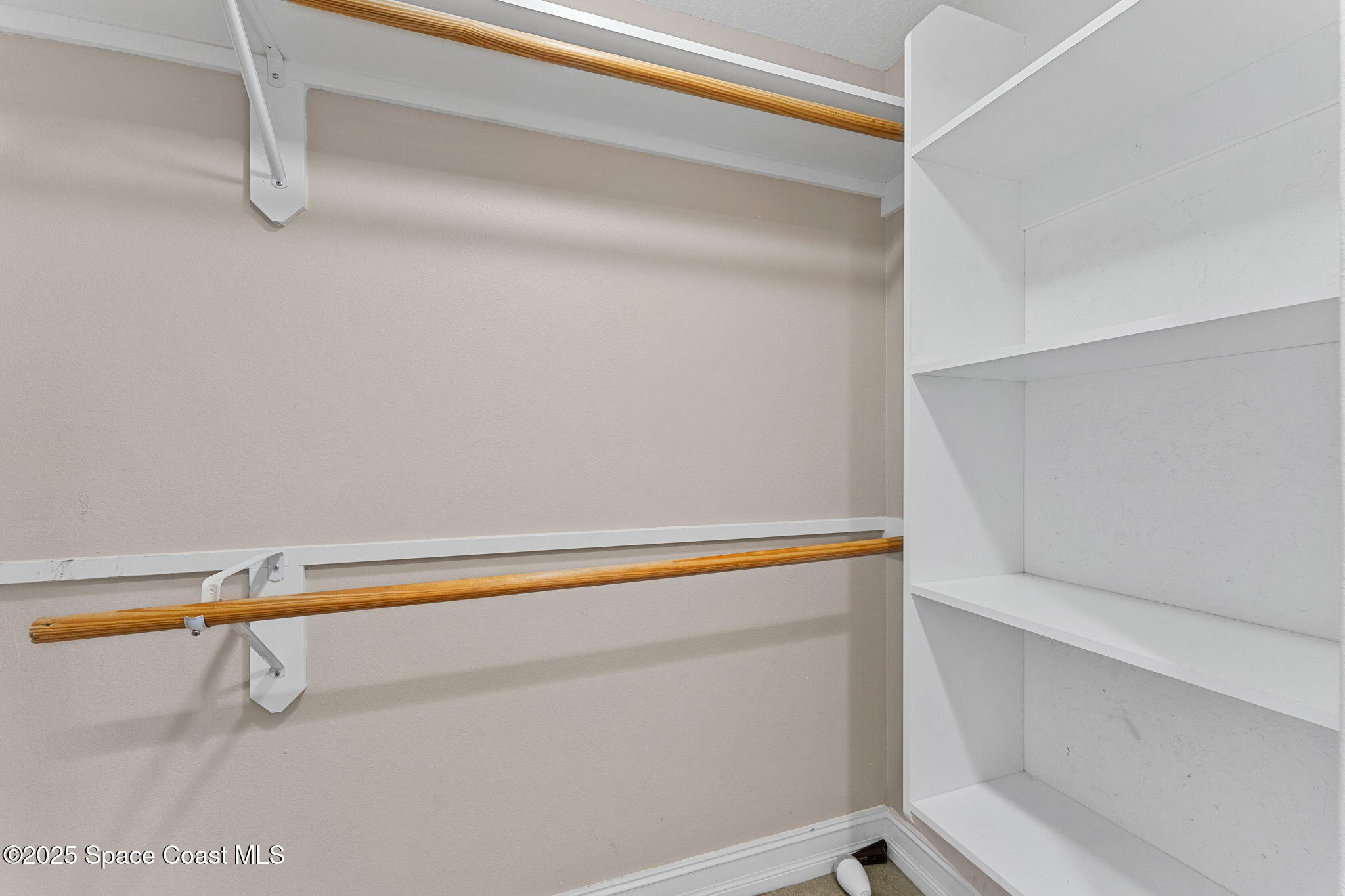 480 Sail Lane, Unit 204 Merritt Island, FL 32953 - Photo 16 of 32 a close up view of racks on the wall