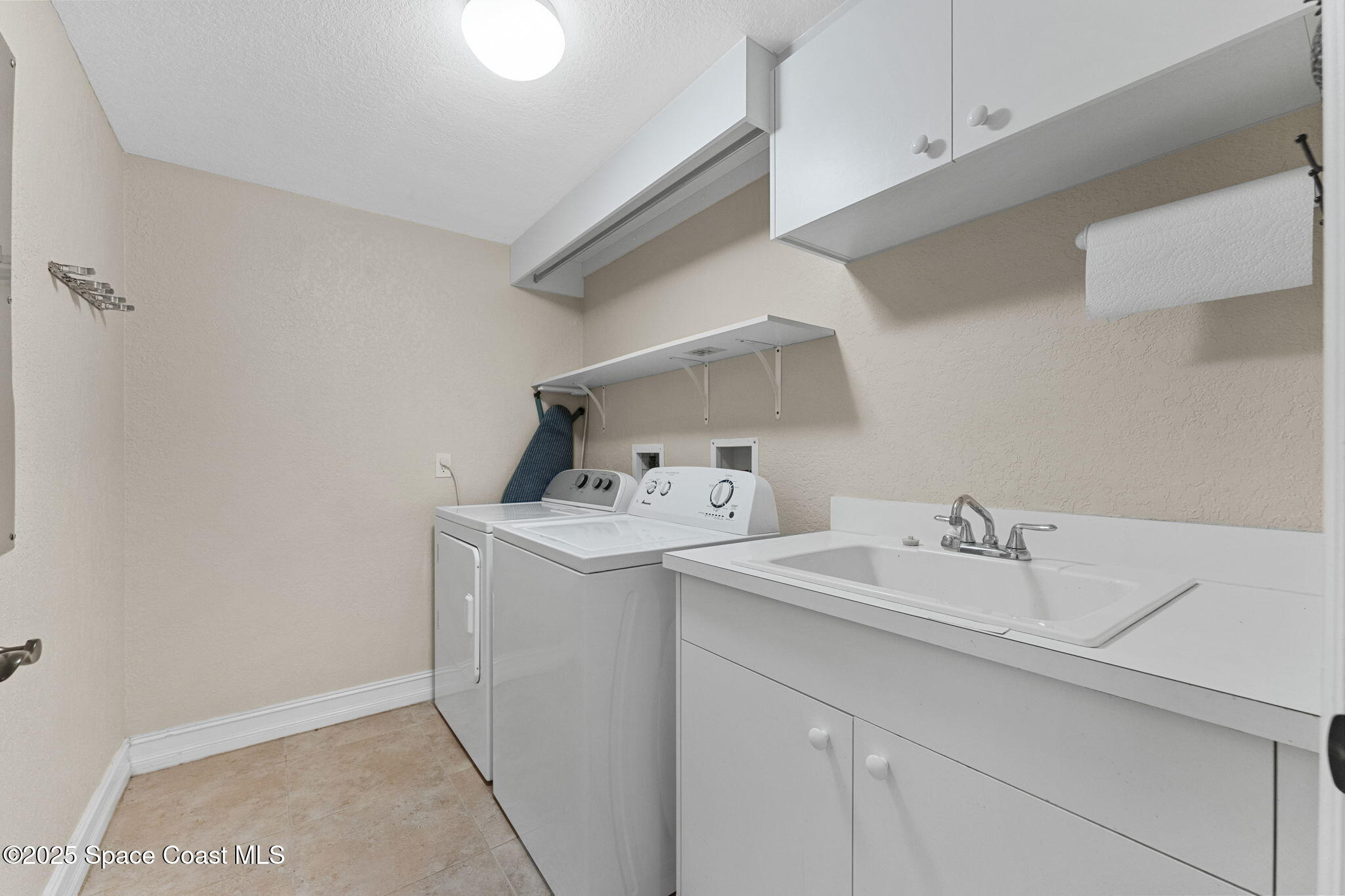 480 Sail Lane, Unit 204 Merritt Island, FL 32953 - Photo 20 of 32 a utility room with dryer and washer