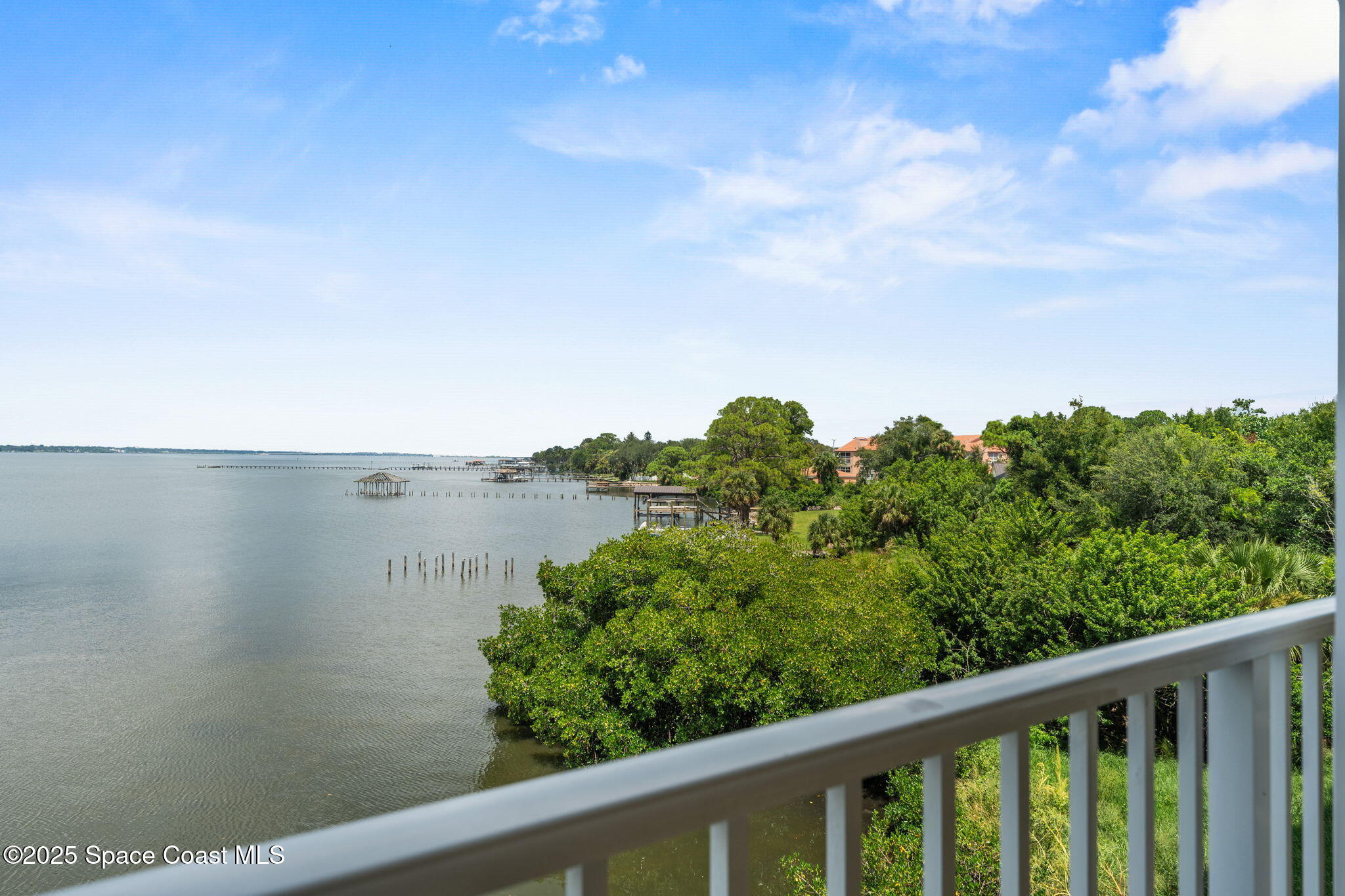 480 Sail Lane, Unit 204 Merritt Island, FL 32953 - Photo 2 of 32 a view of a lake from a balcony