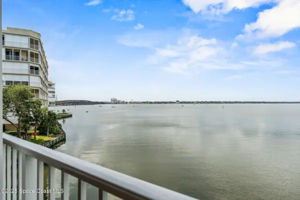 a view of a lake from a balcony