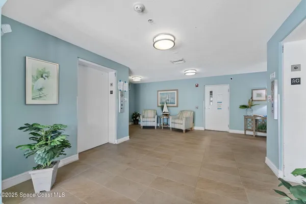 a view of livingroom with furniture and a potted plant