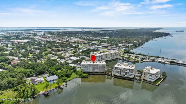 an aerial view of a house with outdoor space