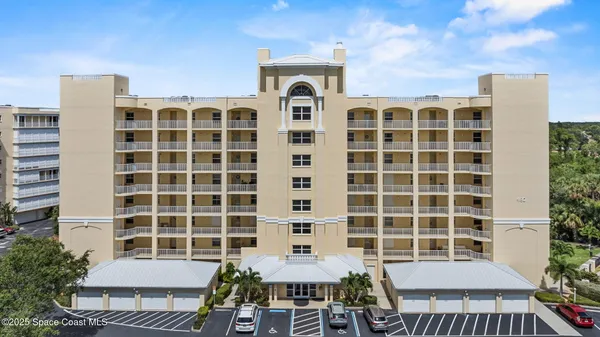a front view of a building with a yard