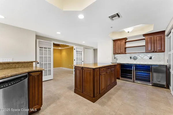 a kitchen with stainless steel appliances granite countertop a stove and a sink