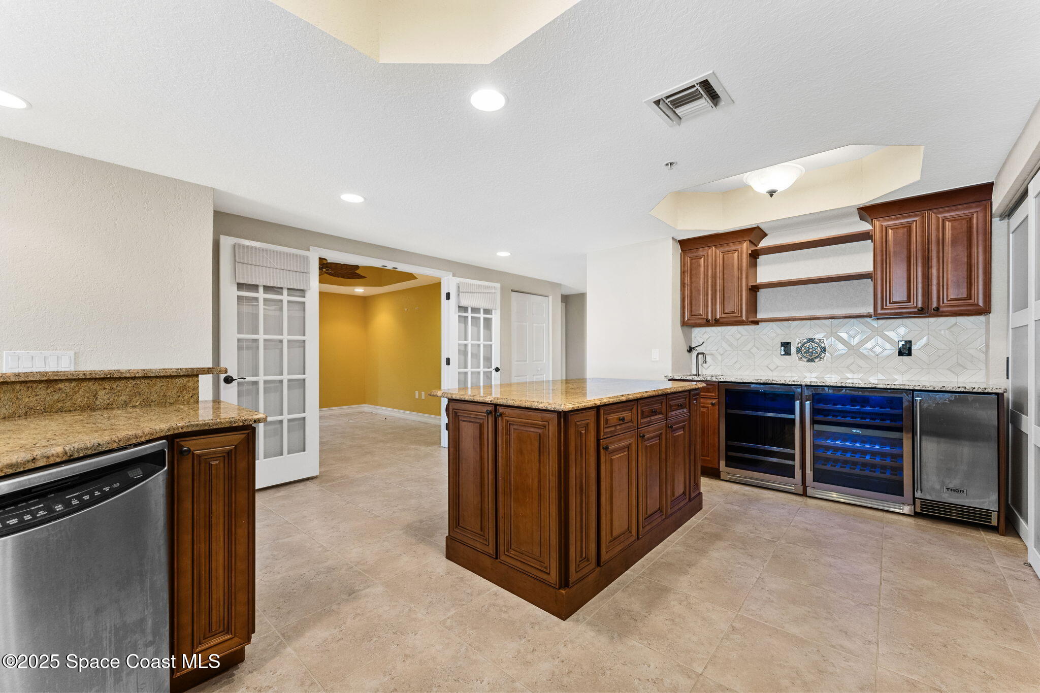 480 Sail Lane, Unit 204 Merritt Island, FL 32953 - Photo 5 of 32 a kitchen with stainless steel appliances granite countertop a stove and a sink