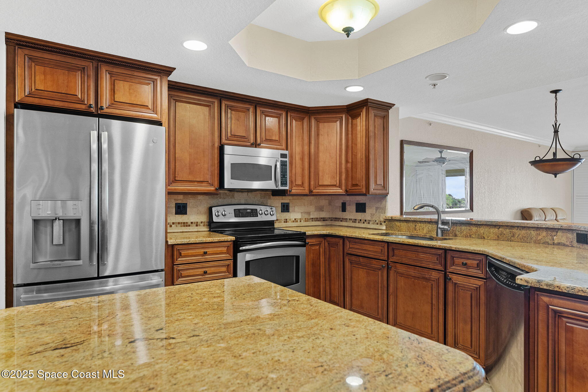 480 Sail Lane, Unit 204 Merritt Island, FL 32953 - Photo 6 of 32 a kitchen with stainless steel appliances a refrigerator stove and sink
