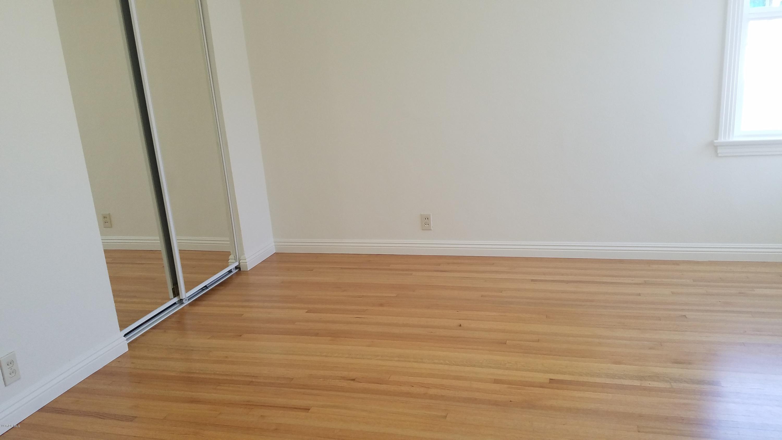 310 West Roderick Avenue Oxnard, CA 93030 - Photo 14 of 41 a view of an empty room with wooden floor