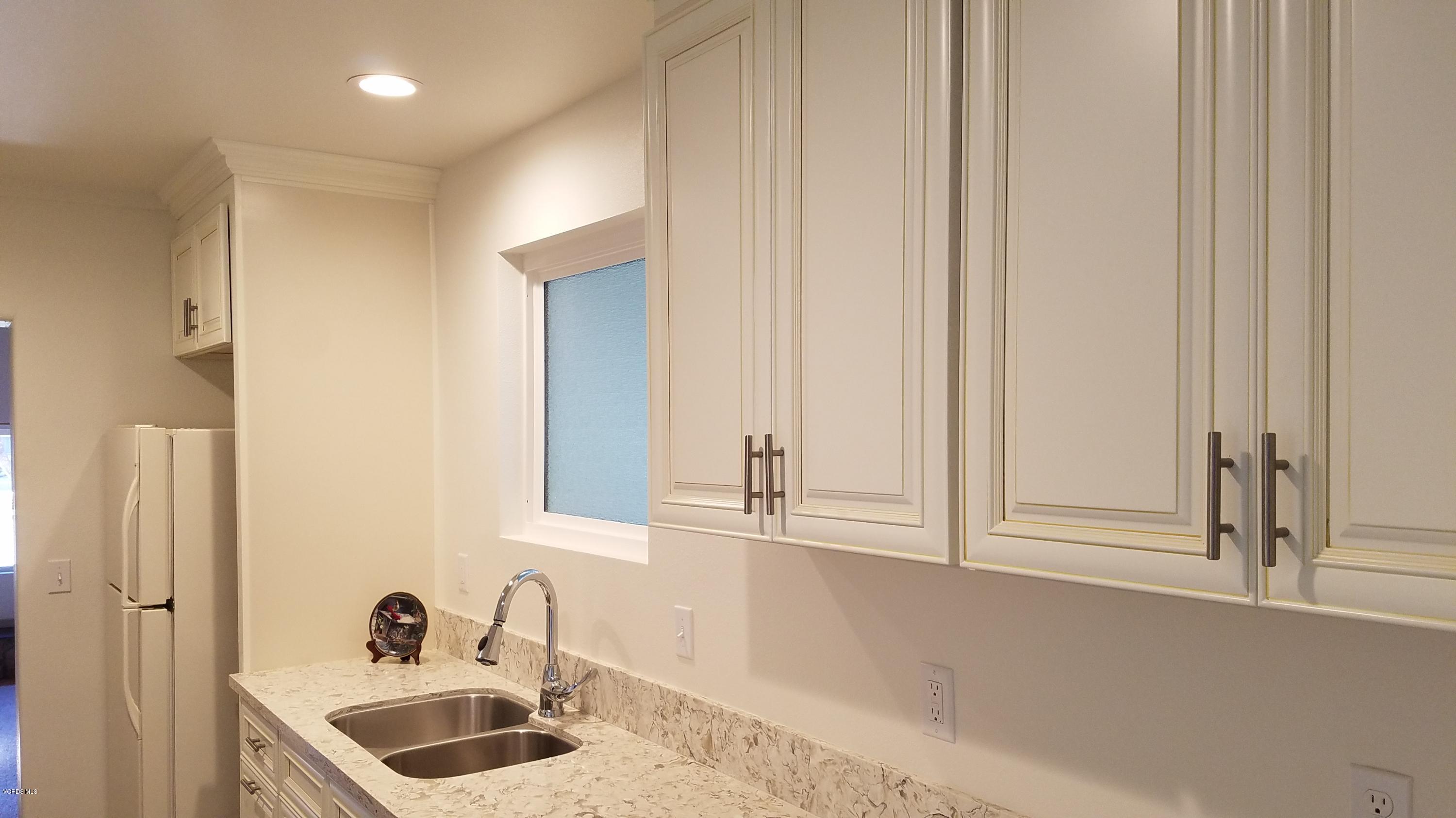 310 West Roderick Avenue Oxnard, CA 93030 - Photo 22 of 41 a bathroom with a sink and a mirror