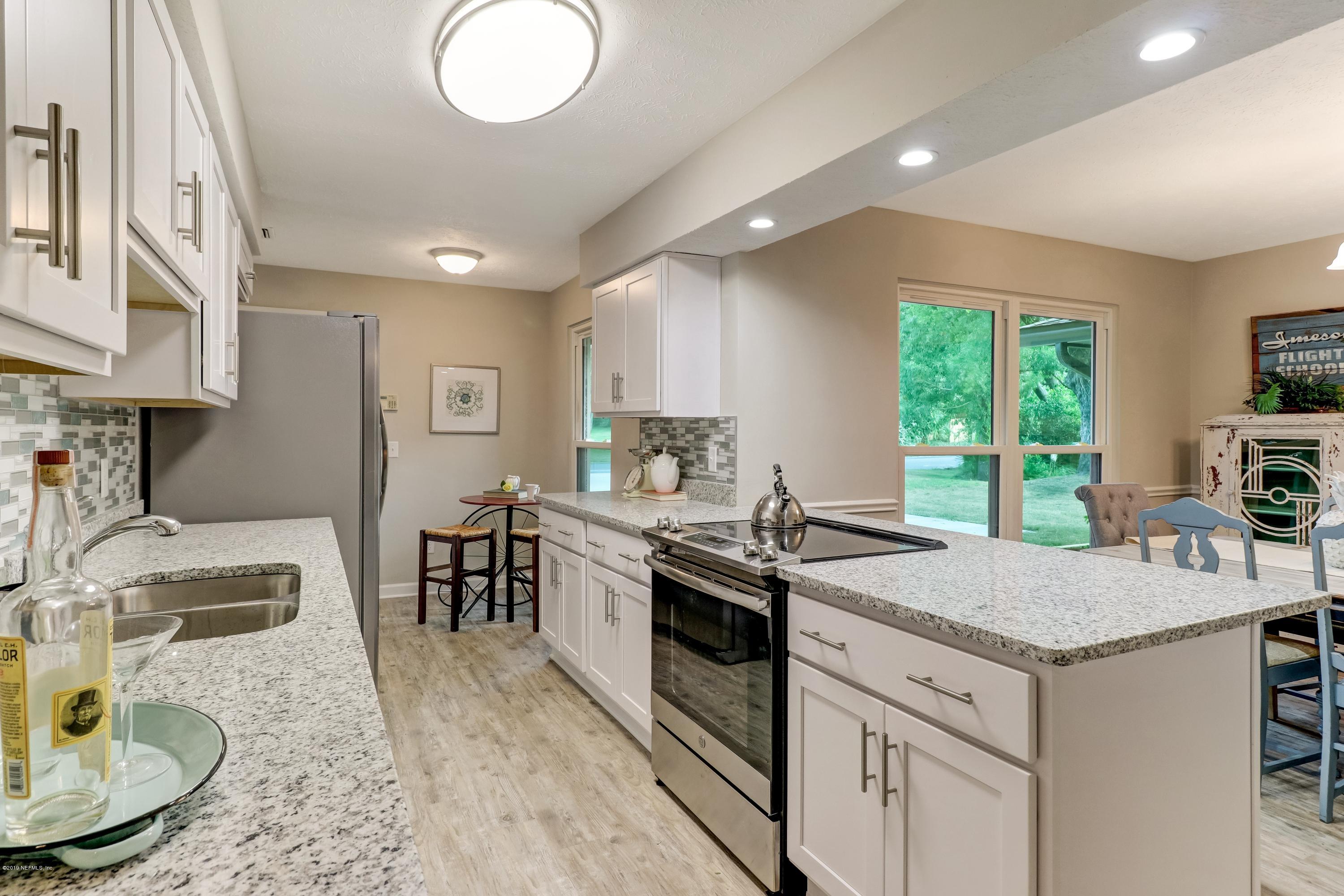234 Foxridge Road Orange Park, FL 32065 - Photo 3 of 42 Kitchen Granite and White Shaker Cab's