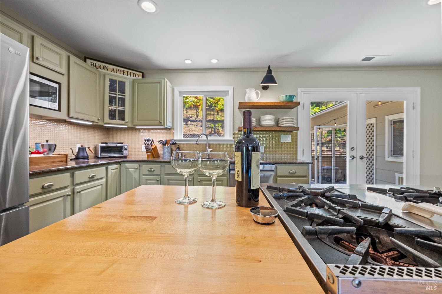 1389 Canyon Road Geyserville, CA 95441 - Photo 14 of 59 a kitchen with stainless steel appliances granite countertop a stove and a sink