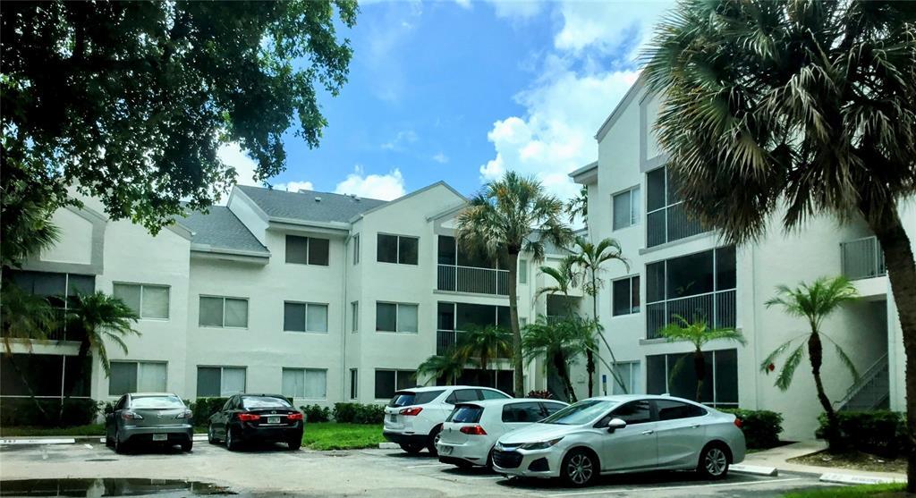 5780 Rock Island Road, Unit 367 Tamarac, FL 33319 - Photo 12 of 13 a front view of a house with parking space